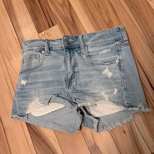 Lace pocket stretch jean shorts